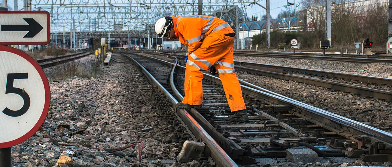 Railway Worker On Tracks